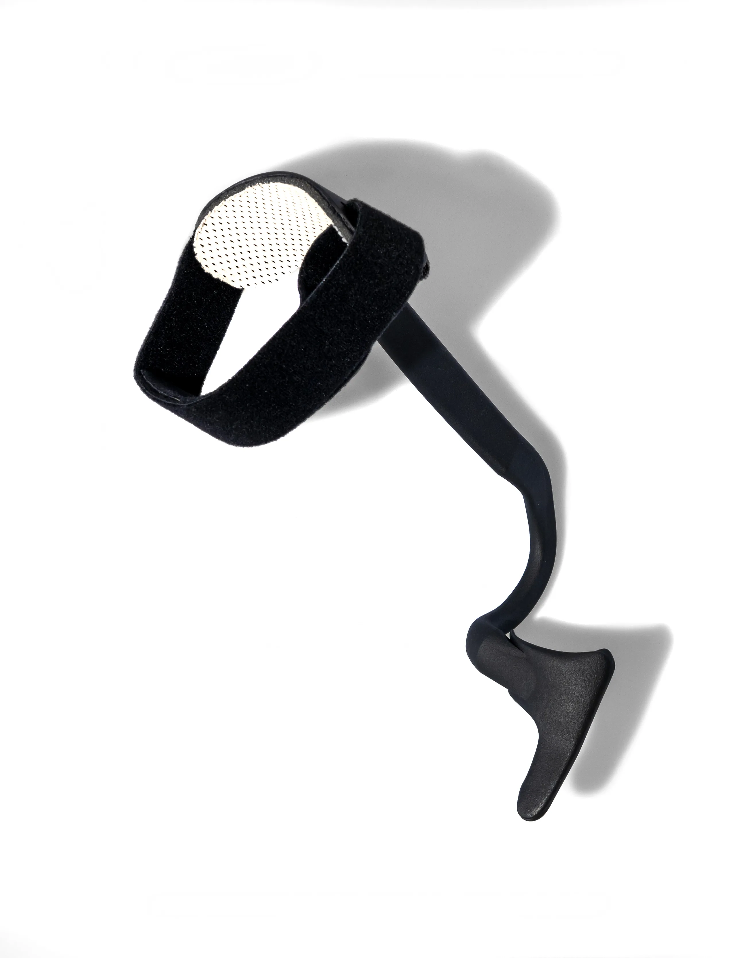 The Rise on its own, seen from above: the velcro strap for below the knee, the thin strip along the leg and the footplate that rests on top of the foot, under the laces.